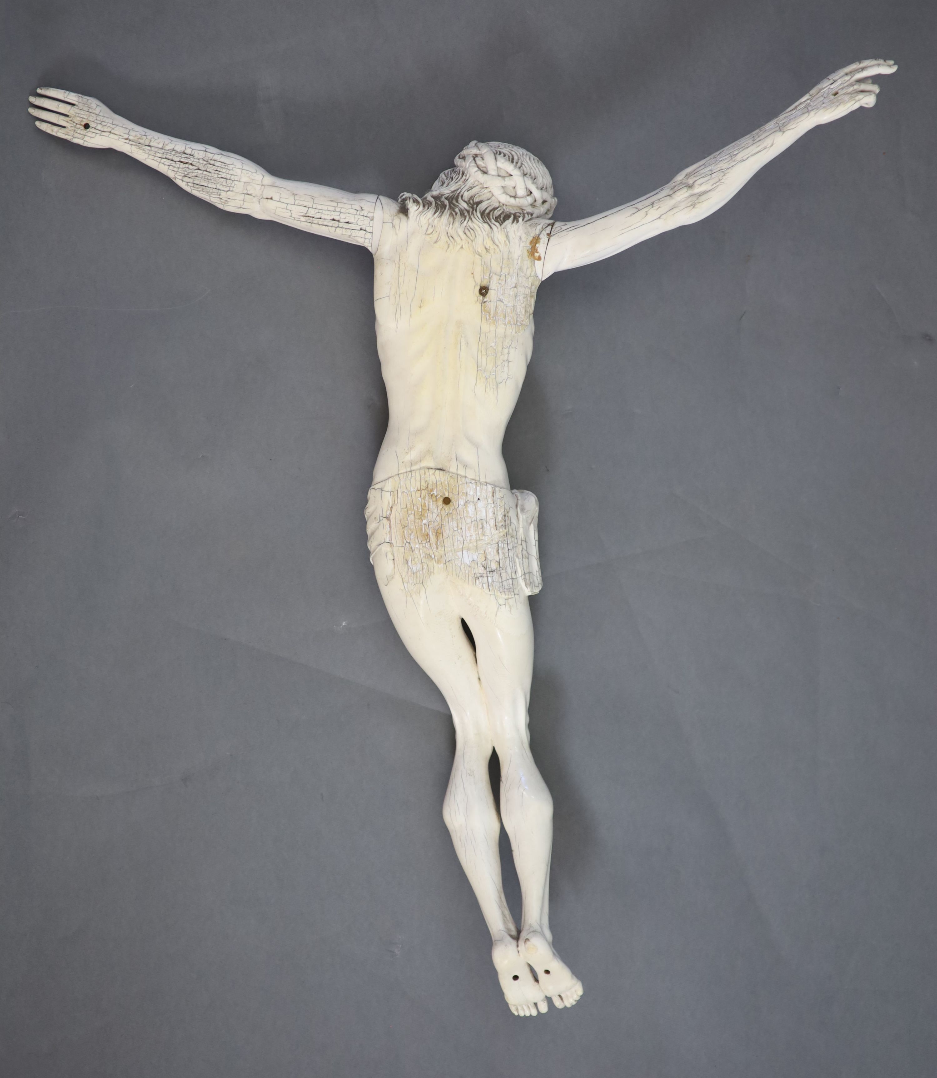 After Joseph Deutschmann (1717-1787) a very large German carved ivory Corpus Christi, 19th century 75cm wide, 75cm high.